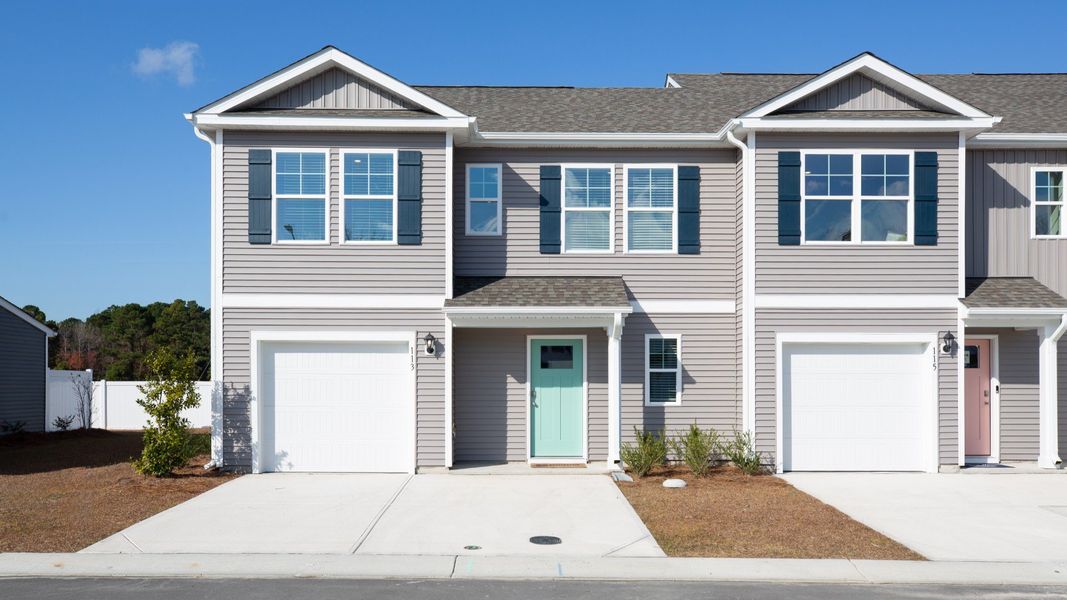 Front exterior of a home in the Townes at Seabrooke community, located in Leland, NC (Image 3).
