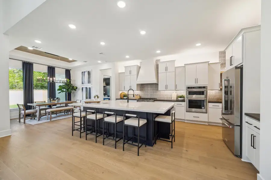 Furnished interior in a model home at Audubon - 70' in Magnolia (Image 5).