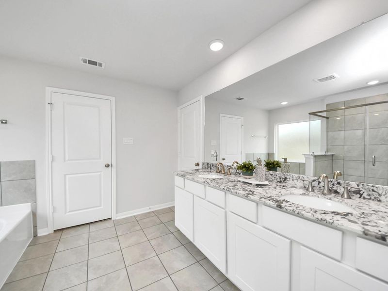 Furnished interior in a model home at Sunterra in Katy (Image 29).