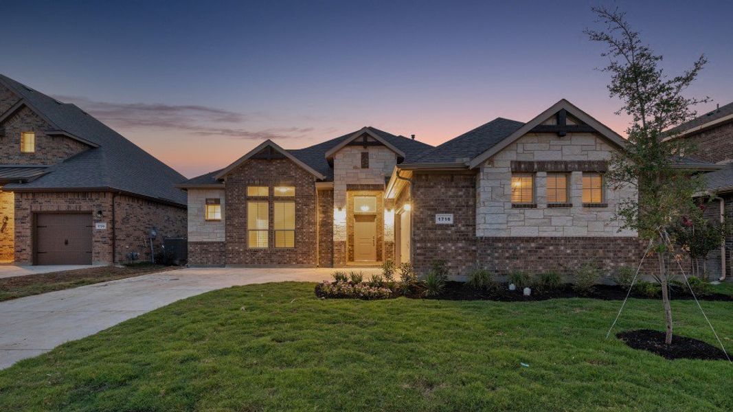 Front exterior of a home in the Eden Ranch community, located in Arlington, TX (Image 11).