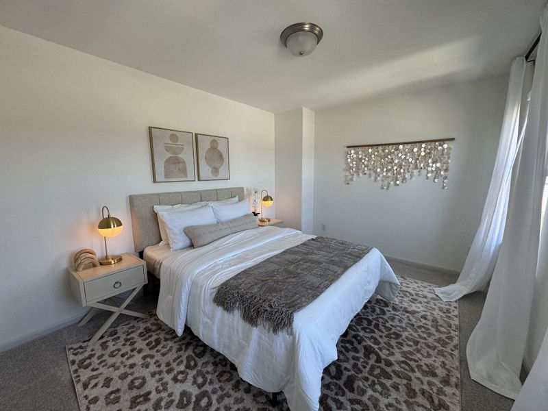 A cozy bedroom with neutral tones, abstract art, stylish lighting, and a textured rug for a serene ambiance. A cozy bedroom with neutral tones, abstract art, stylish lighting, and a textured rug for a serene ambiance.