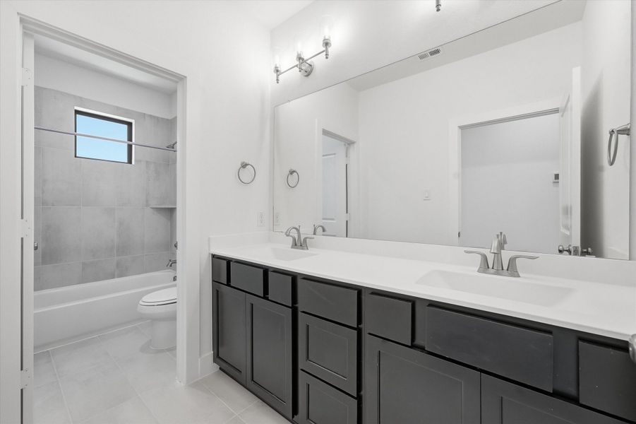 Furnished interior in a model home at Symphony in Montgomery (Image 36).