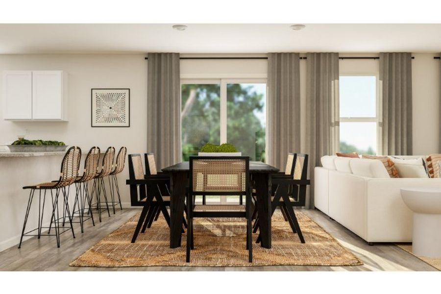 A living room with a table and chairs.