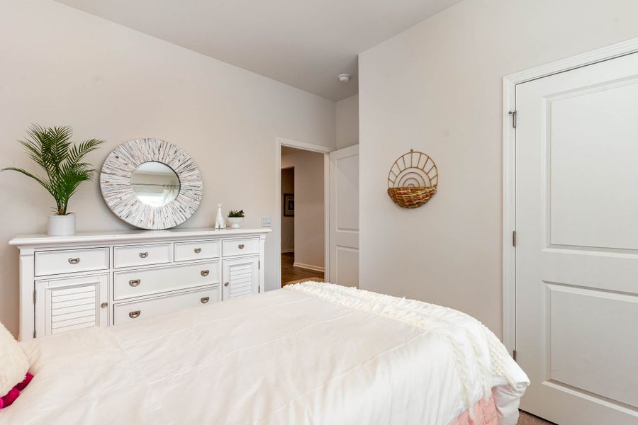 Furnished interior in a model home at Island Green in Myrtle Beach (Image 50).