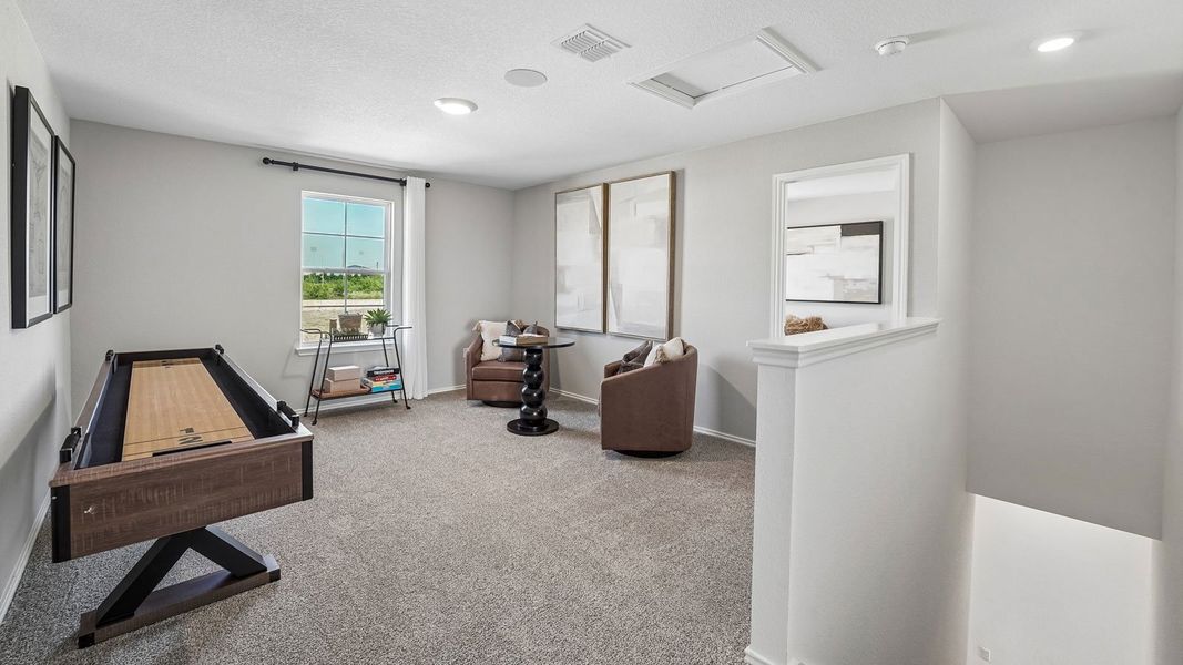 Furnished interior in a model home at Palomino in Manor (Image 27).