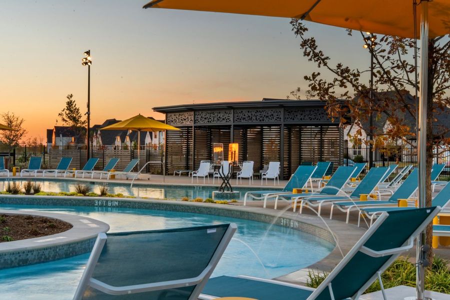 Lounge chairs by lazy river in Mosaic, Celina, Texas