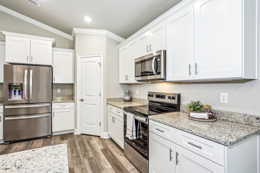 Furnished interior in a model home at Doyle Hawkins Landing in Navarre (Image 5).