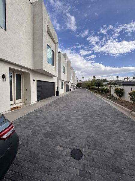 Modern white homes with sleek lines and paved driveways in Turney Court by Bolte Homes (Phoenix, AZ). Modern white homes with sleek lines and paved driveways in Turney Court by Bolte Homes (Phoenix, AZ).
