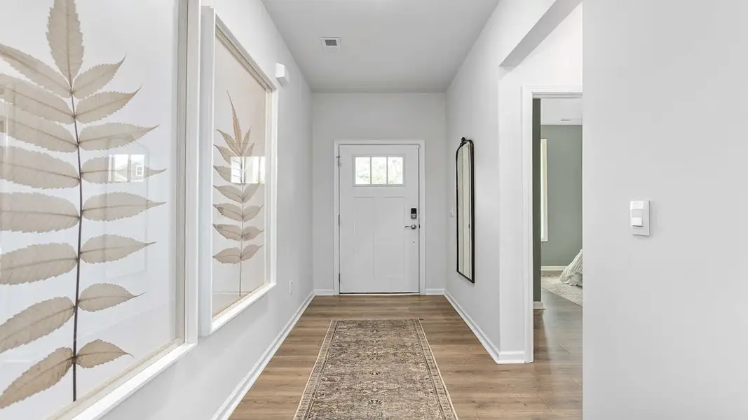 Furnished interior in a model home at The Villas at Kinsley in Jamestown (Image 3).