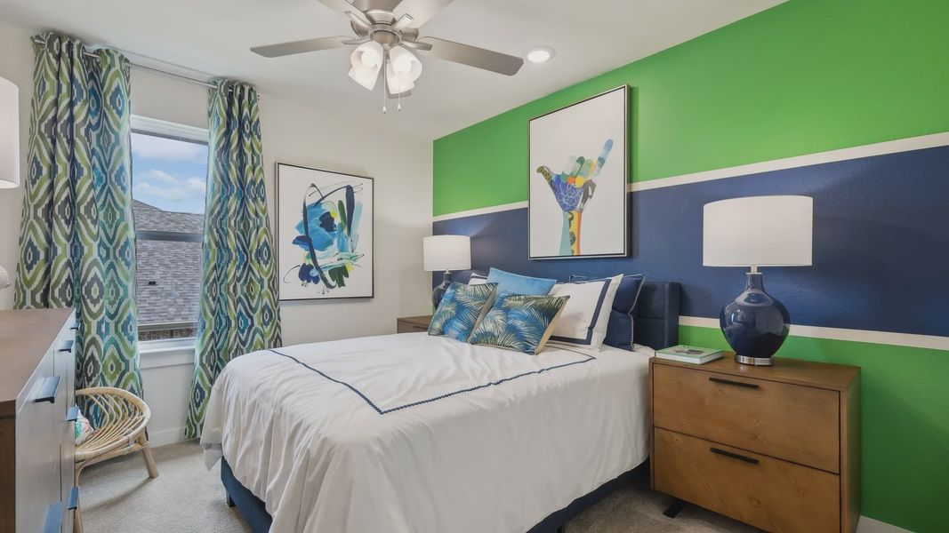 Churchill's vibrant bedroom boasts abstract art, stylish ceiling fan, and richly hued accent wall. Churchill's vibrant bedroom boasts abstract art, stylish ceiling fan, and richly hued accent wall.