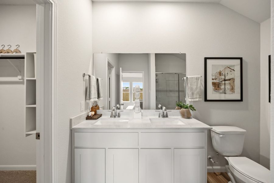 A bathroom with white cabinets. A bathroom with white cabinets.