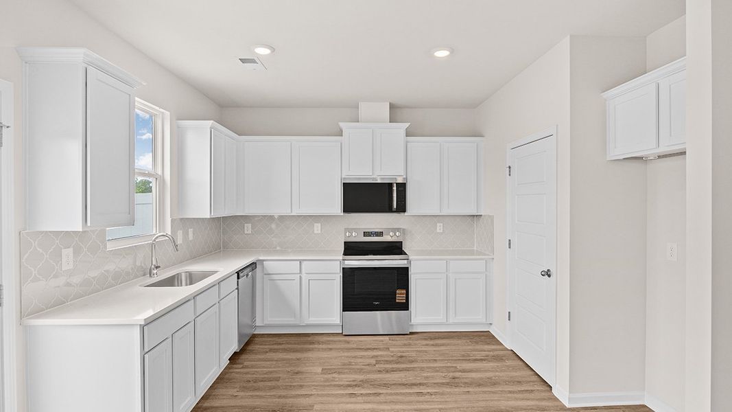 Furnished interior in a model home at Remington Chase in Perry (Image 5).