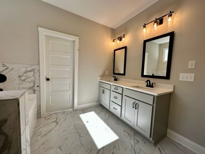 Furnished interior in a model home at Triple Park in Moreland (Image 15).