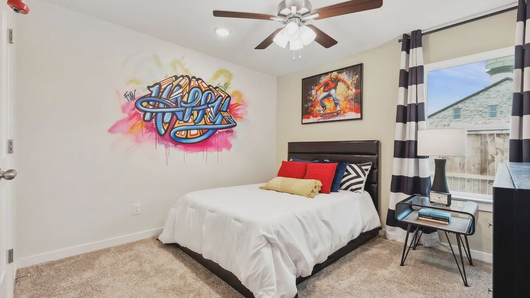 Chic design with bold graffiti art, plush carpet, and modern decor in Simpson Crossing.