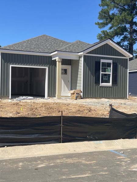 A modern home with green siding and an unfinished yard in the Settlement at Salamander by D.R. Horton (North Charleston, SC). A modern home with green siding and an unfinished yard in the Settlement at Salamander by D.R. Horton (North Charleston, SC).
