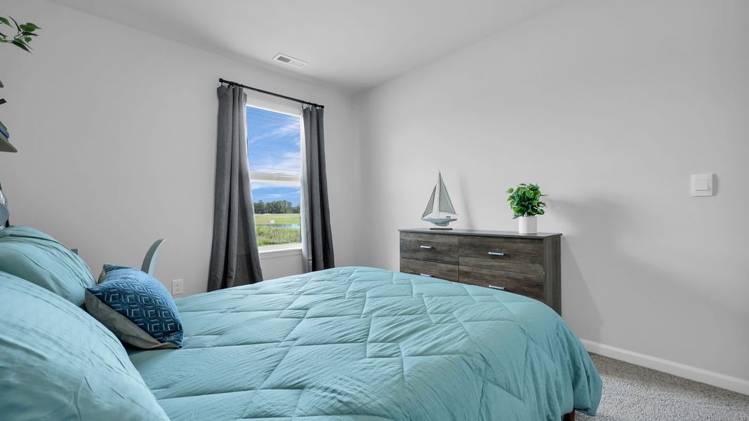 Furnished interior in a model home at The Ranch in Holly Hill (Image 25).