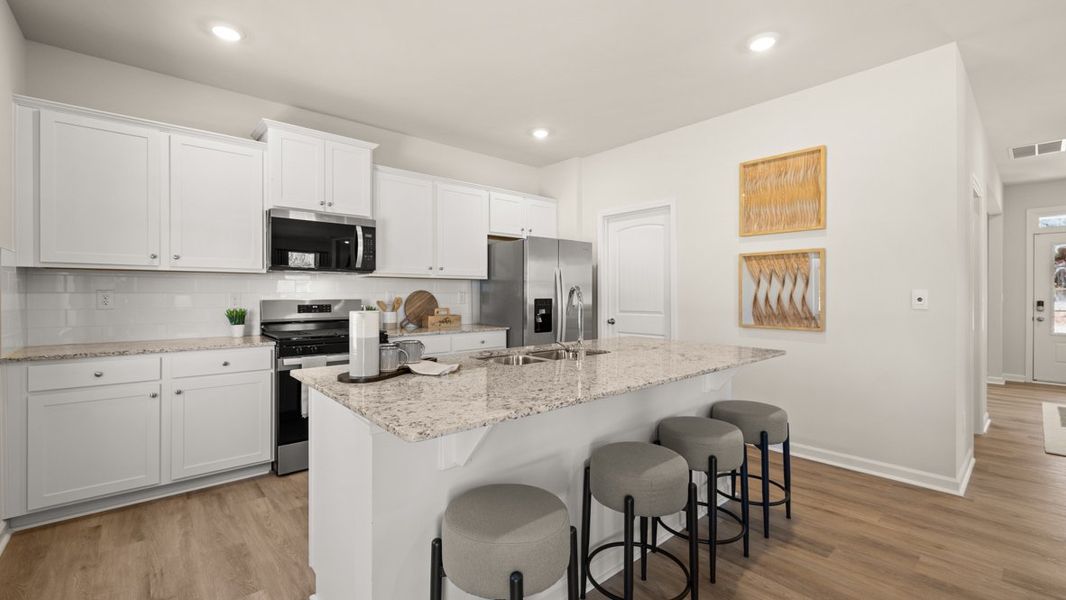 Furnished interior in a model home at South Wind in Fairburn (Image 7).