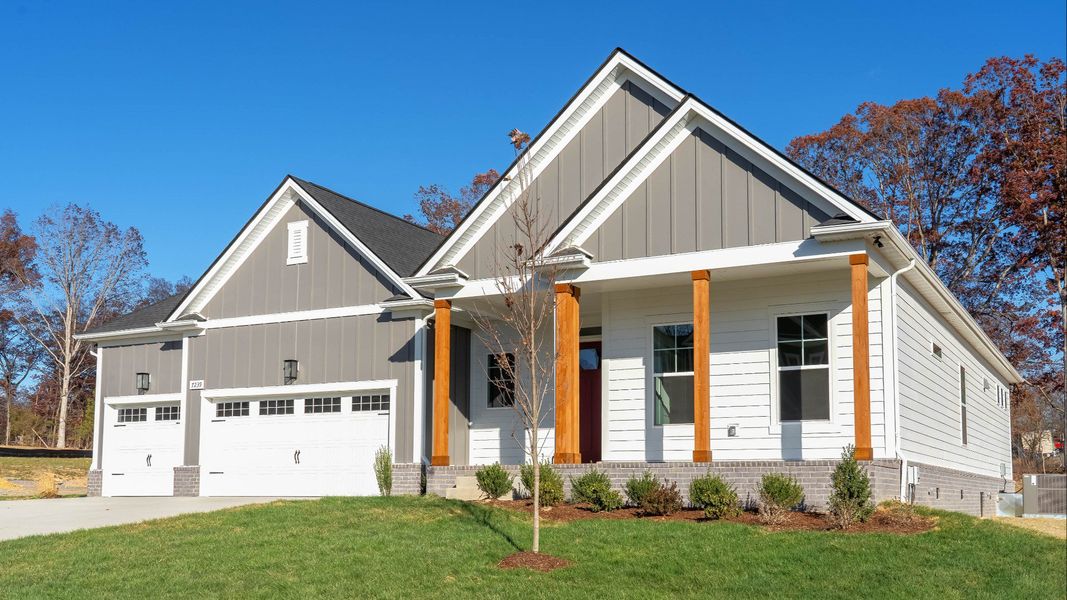 Burgess plan exterior with 3-car garage and covered front porch Burgess plan exterior with 3-car garage and covered front porch