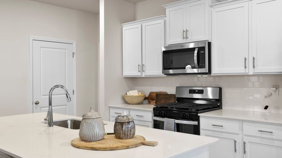 Furnished interior in a model home at Benjamin's Grove in Woodruff (Image 18).