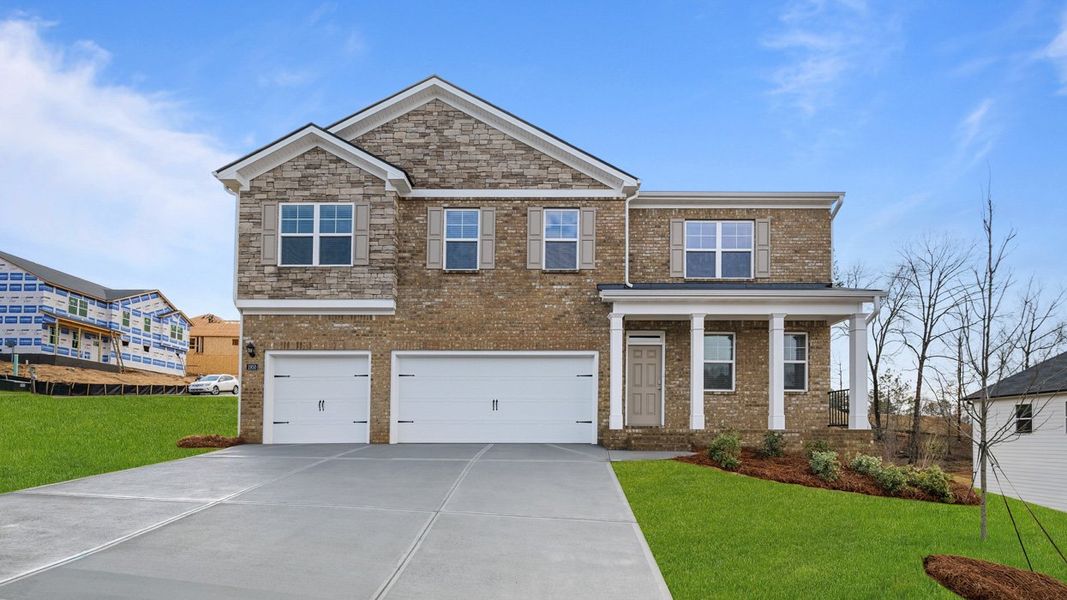 Front exterior of a home in the Brooks Station community, located in Dacula, GA (Image 12).