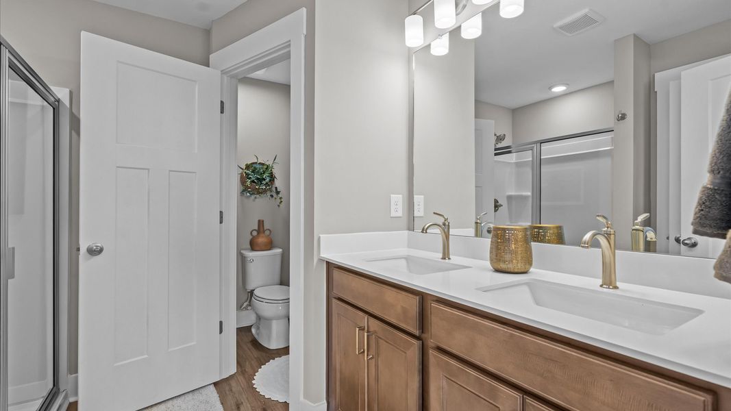 Spa-like primary bathroom with double sink vanity in two story townhome at Saluda Crossing by DRB Homes in Piedmont, SC Spa-like primary bathroom with double sink vanity in two story townhome at Saluda Crossing by DRB Homes in Piedmont, SC