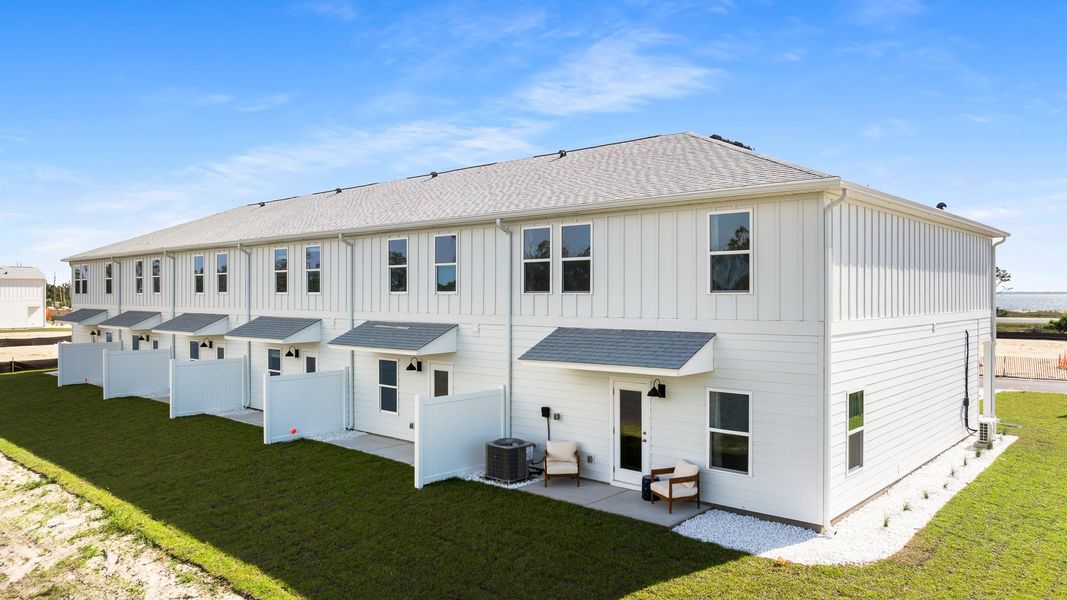 Front exterior of a home in the WindMark Townhomes community, located in Port Saint Joe, FL (Image 11).