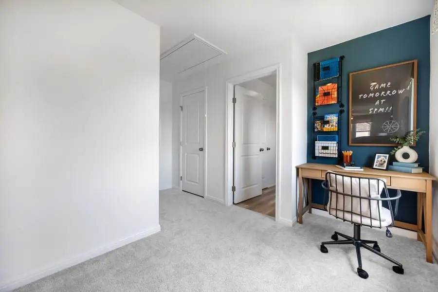 Furnished interior in a model home at Stonewall Ranch 40s in Liberty Hill (Image 37).