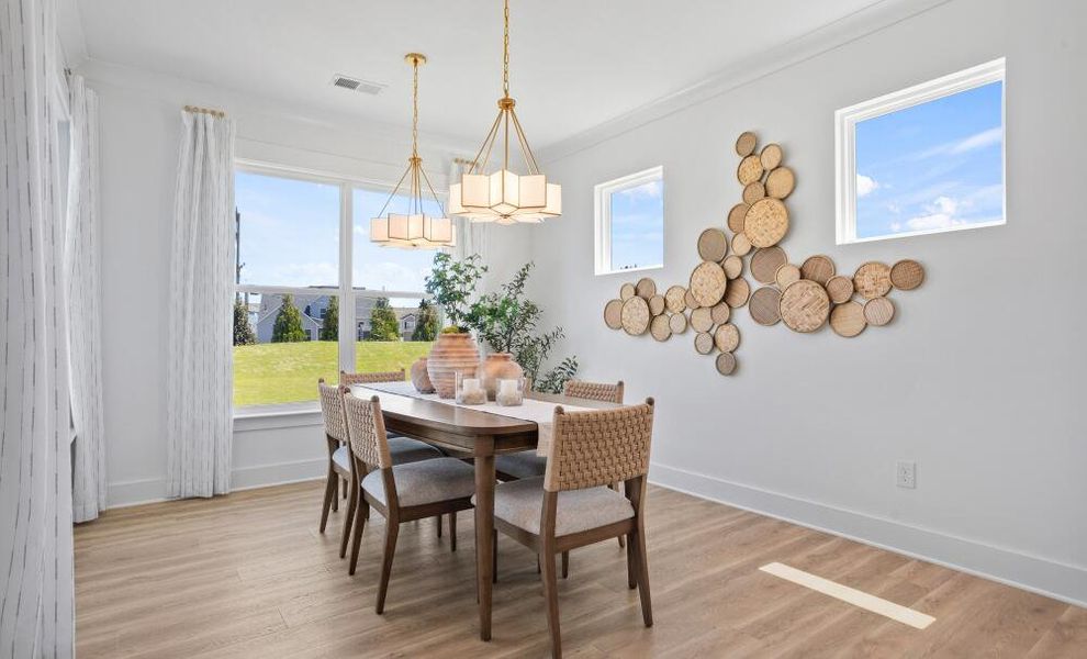 Furnished interior in a model home at The Enclave at Hidden Lake - 55+ Community in Youngsville (Image 12).