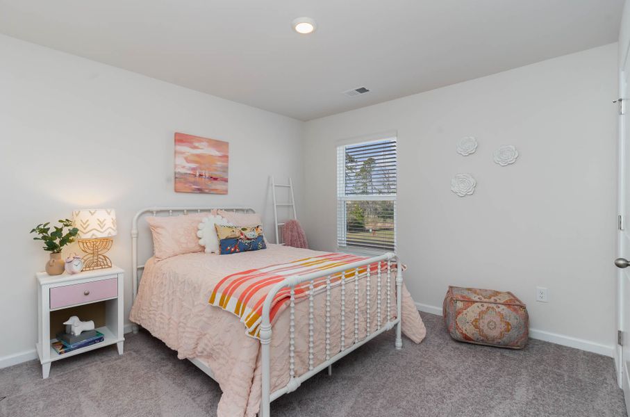 Furnished interior in a model home at Island Green in Myrtle Beach (Image 43).