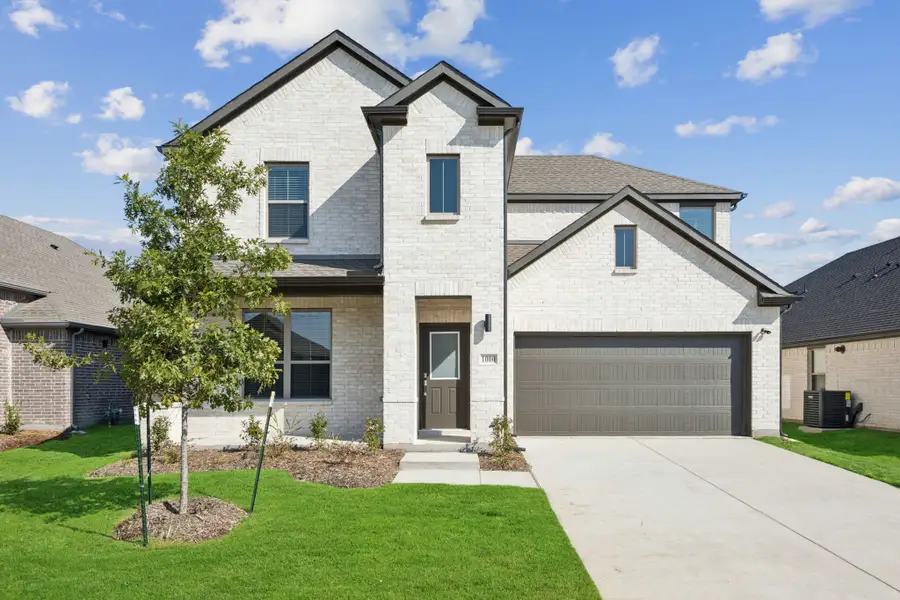 Front exterior of a home in the Rocky Creek Crossing community, located in Crowley, TX (Image 1). Front exterior of a home in the Rocky Creek Crossing community, located in Crowley, TX (Image 1).