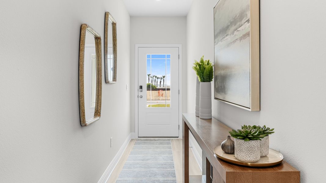 Furnished interior in a model home at WindMark Townhomes in Port Saint Joe (Image 13).