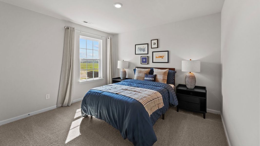 Furnished interior in a model home at Ridgewood Farms in Winterville (Image 32).