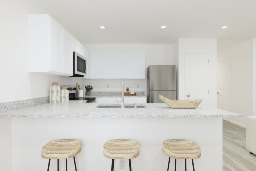 A kitchen with white cabinets. A kitchen with white cabinets.
