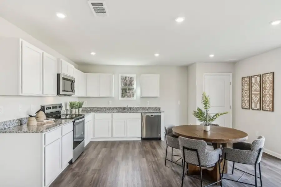 A kitchen with white cabinets. A kitchen with white cabinets.