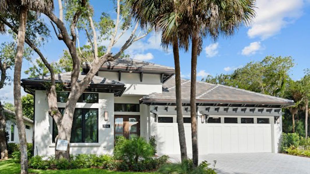 Front exterior of a home in the Seaglass community, located in Vero Beach, FL (Image 61).