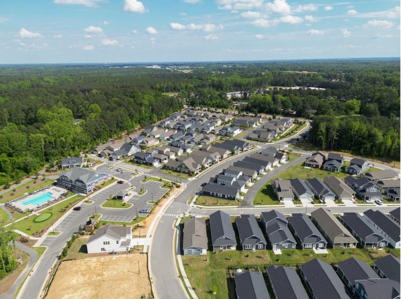 Aerial view of the The Walk at East Village community in Clayton, NC, showing layout and nearby surroundings (Image 1). Aerial view of the The Walk at East Village community in Clayton, NC, showing layout and nearby surroundings (Image 1).