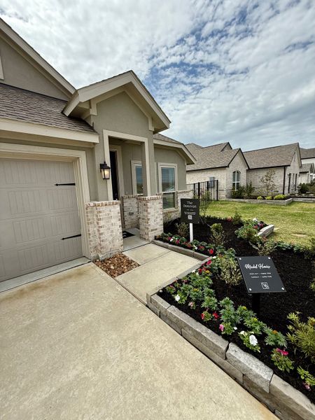 A charming façade with manicured landscaping in Lago Mar by Lennar (Texas City, TX).