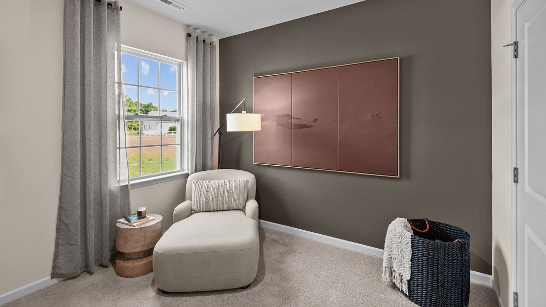 Furnished interior in a model home at The Preserve at Kinsley in Jamestown (Image 12).