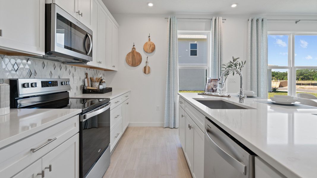 Trinity Place Staged Model Ambersweet Kitchen by DRB Homes in Saint Cloud FL Trinity Place Staged Model Ambersweet Kitchen by DRB Homes in Saint Cloud FL