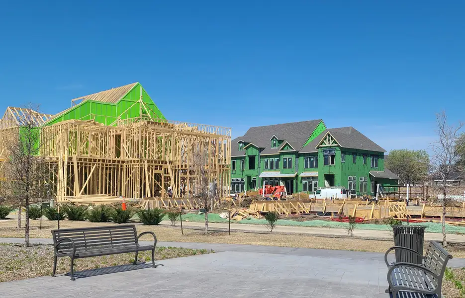 New construction homes under blue skies in Newman Village by Centre Living Homes, Frisco, TX. New construction homes under blue skies in Newman Village by Centre Living Homes, Frisco, TX.