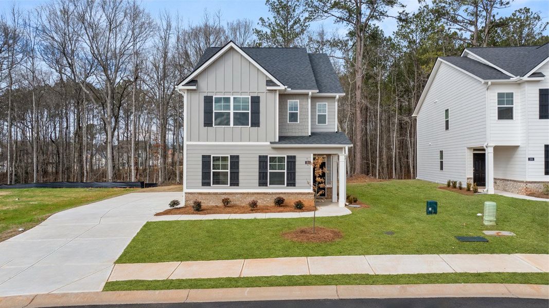 Front exterior of a home in the Oakchase at Hampton community, located in Hampton, GA (Image 13).