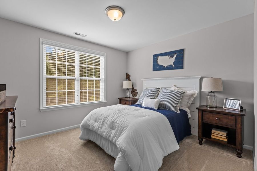 Furnished interior in a model home at The Preserve at Langston in Winterville (Image 18).