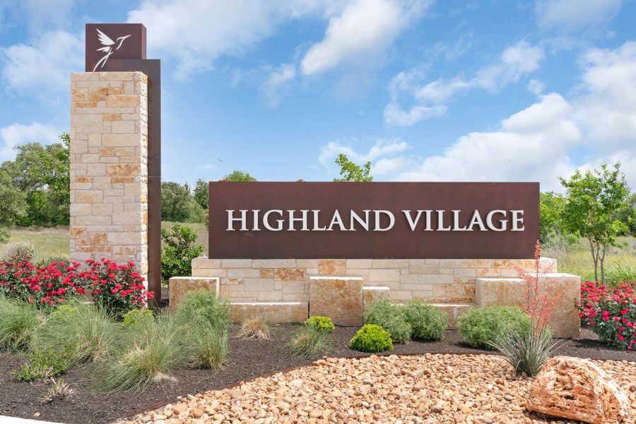 Entrance to the Highland Village community in Georgetown, TX, featuring signage and landscaping (Image 1).