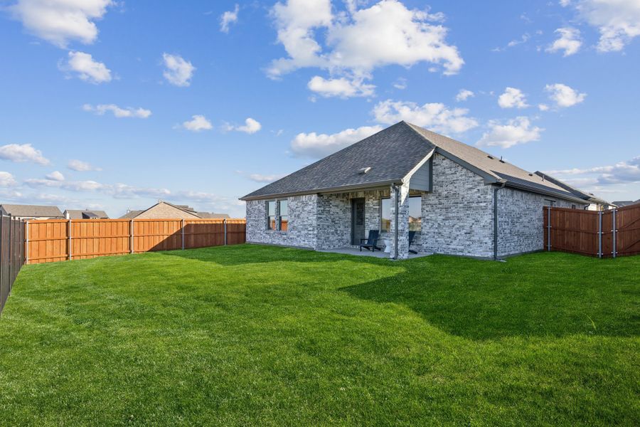REPRESENTATIVE PHOTO – Covered Patio in the Oscar model home in Aledo TX by Trophy Signature Homes