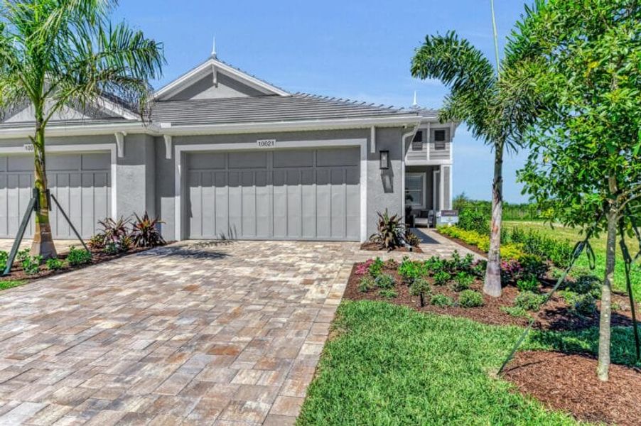 Front exterior of a home in the Reflection Villas at Watercolor Place community, located in Bradenton, FL (Image 4). Front exterior of a home in the Reflection Villas at Watercolor Place community, located in Bradenton, FL (Image 4).
