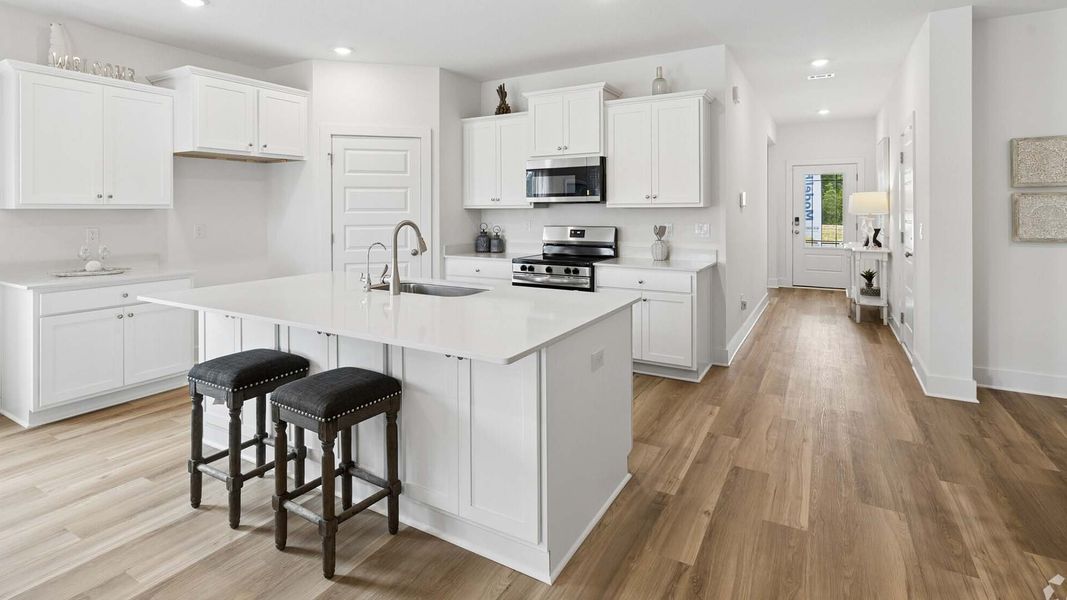 Furnished interior in a model home at Ashton Park Phase III in Freeport (Image 4).