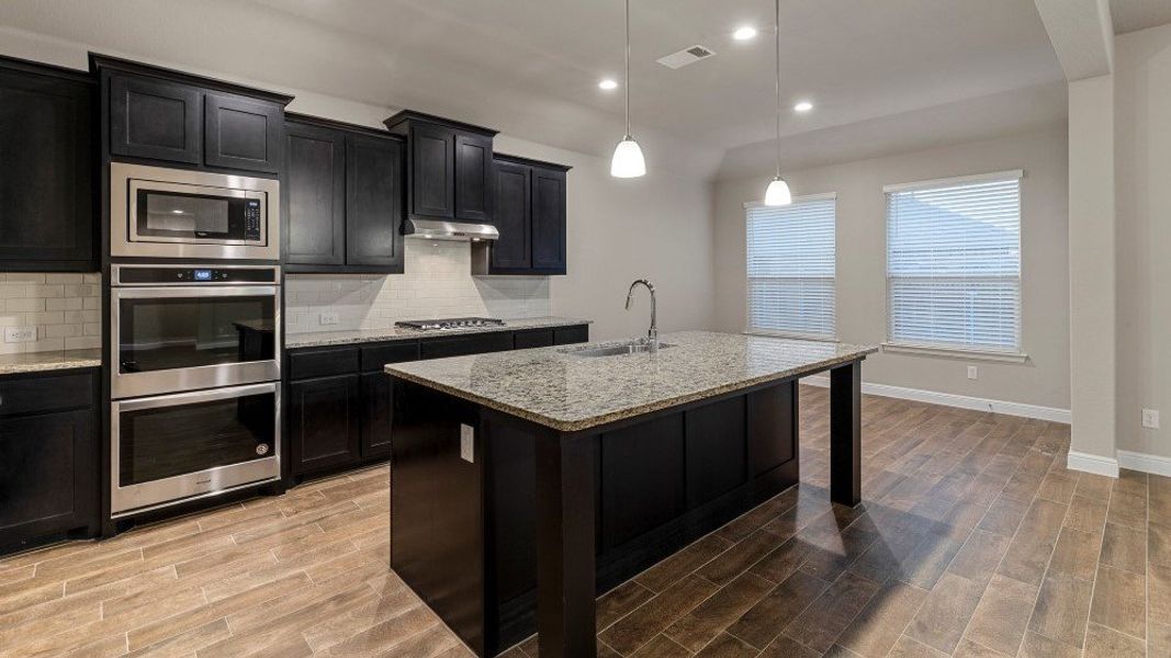 Furnished interior in a model home at Eden Ranch in Arlington (Image 22).