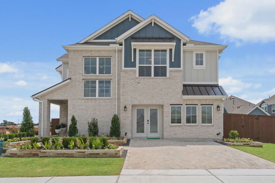 Front exterior of a home in the Meridiana Courtyard Collection community, located in Manvel, TX (Image 5). Front exterior of a home in the Meridiana Courtyard Collection community, located in Manvel, TX (Image 5).