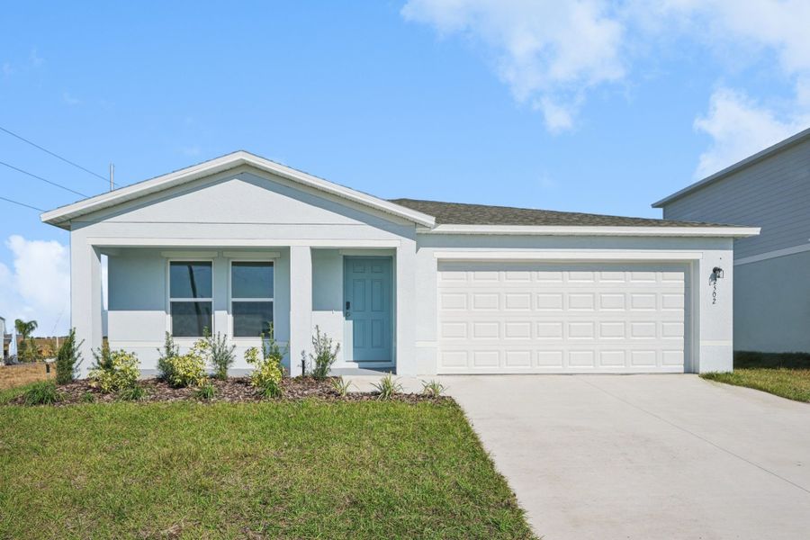 A white house with a garage. A white house with a garage.