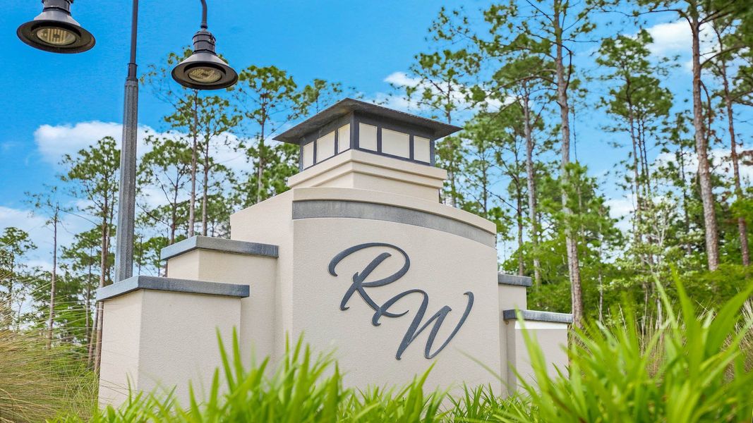 Entrance to the Riverwalk community in Freeport, FL, featuring signage and landscaping (Image 6). Entrance to the Riverwalk community in Freeport, FL, featuring signage and landscaping (Image 6).